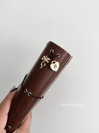 A6 - Amber (MINOR FLAW - Silver Eyelets)